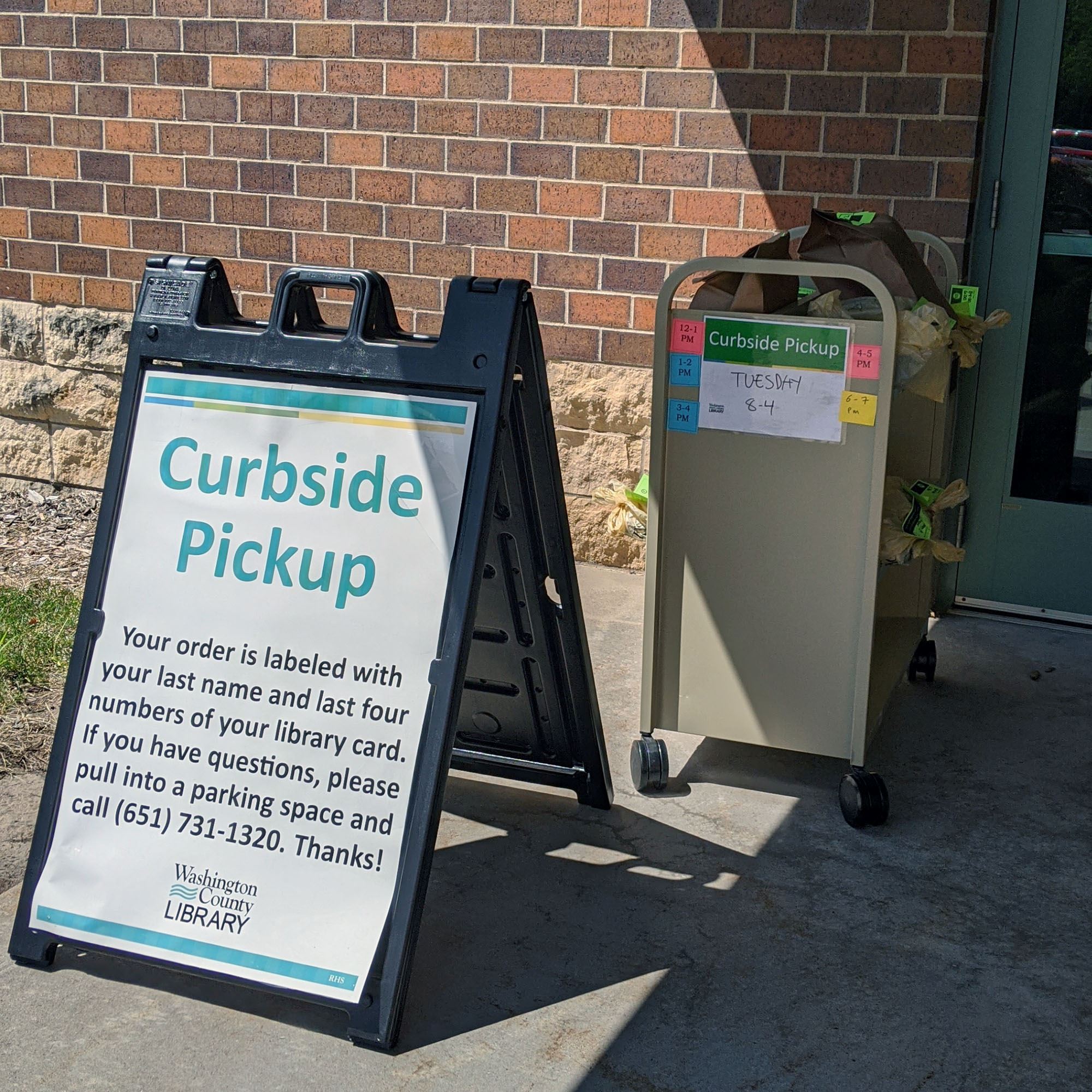 cart with books for curbside pickup at R.H. Stafford Library